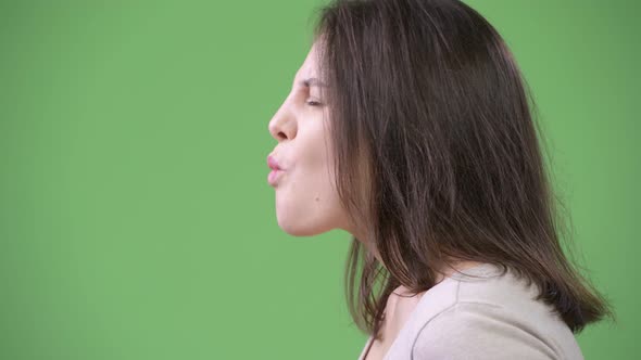 Profile View of Young Beautiful Woman Relaxing with Eyes Closed alt