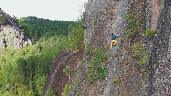 Free Solo Climbing on a Rock Wall in the Siberian Nature Reserve Stolby