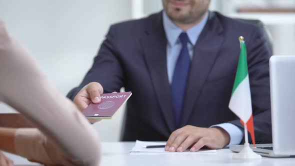 Italian Consular Officer Giving Passport to Immigrant, Citizenship for Refugee alt