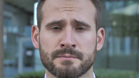 Face of Sad Beard Businessman alt