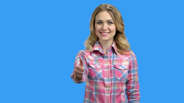 Young Beautiful Woman Giving Thumb Up on Blue Background alt