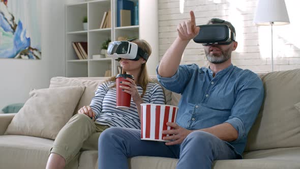Couple Watching Movie in VR Glasses alt