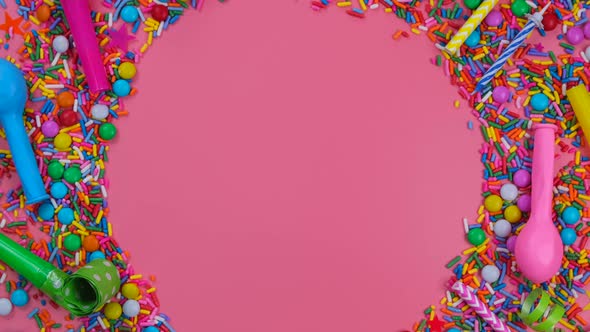 Rotating Pink Background with Candies Balloons and Pipes for a Celebrated Birthday or Party