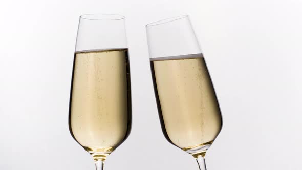 Two Champagne Glasses Toasting alt