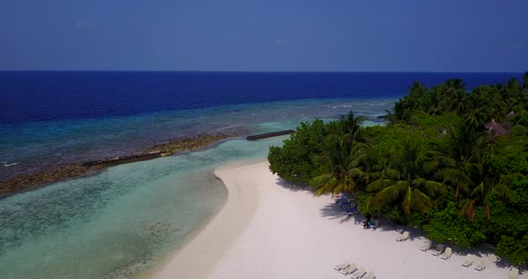 Natural flying travel shot of a summer white paradise sand beach and turquoise sea background alt