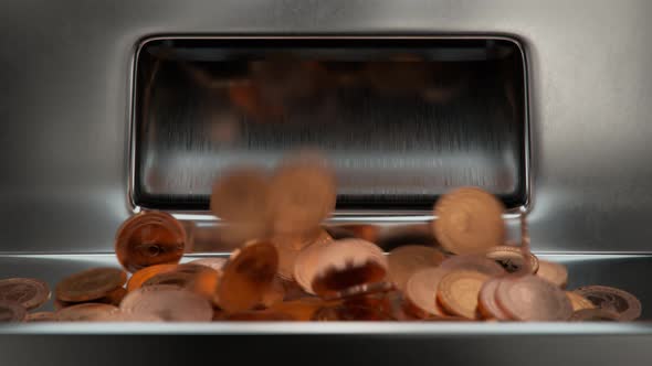 Casino slot machine winner payout. Rose gold or copper coins falling int tray. alt