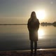Woman Standing Near the Sea Shore at Dawn - VideoHive Item for Sale