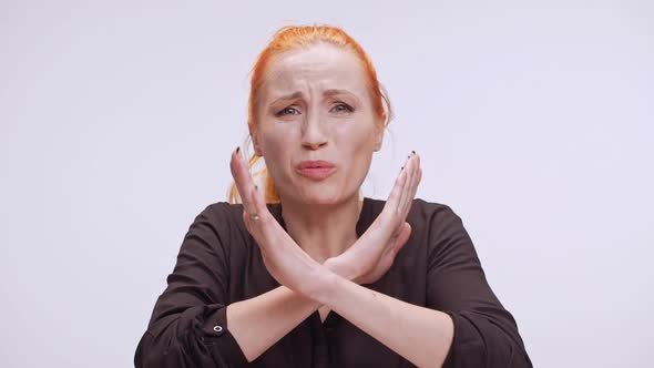 Desperate Caucasian Woman with Colored Orange Hair Almost Crying at Camera Waving Head and Showing alt
