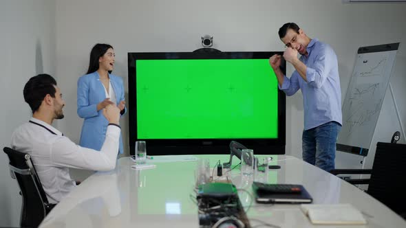 Wide Shot of Office with Chromakey Monitor and Group of Cheerful Multiracial Colleagues Making alt