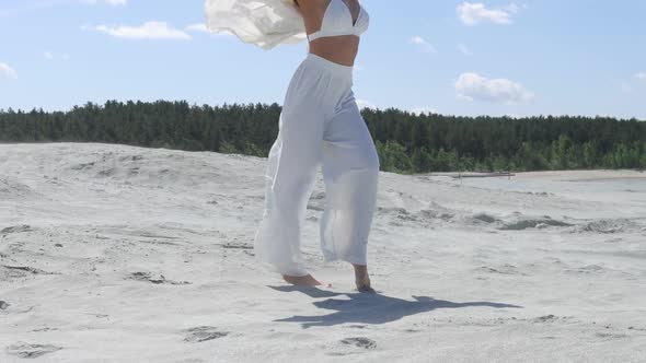 Beautiful Woman Walking on Shore