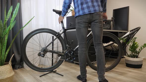 Bicycle workshop. Mechanic working at cycling workshop.  alt