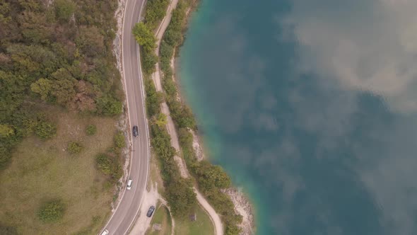 Bird's eye shot of a marvelous reflection of the sky in the lake embraced by charming coastline alt