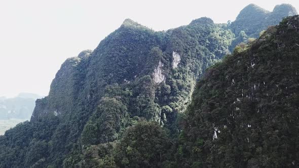 An Aerial View of Green Mountains During the Rain in Thailand