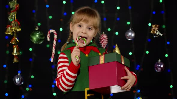 Kid Girl Christmas Elf Santa Claus Helper Costume Licking Candy Cane Lollipop Caramel Sweets alt