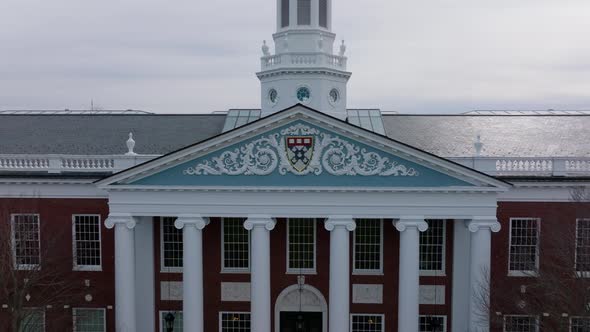 Pull Back Shot of Harvard Business School Coat of Arms in Decoration Above Main Entrance to Baker alt