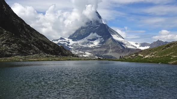 Time lapse of snowy Matterhorn peak and lake Stellisee, Swiss Alps
