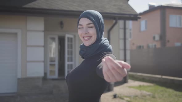 Portrait of Independent Young Muslim Woman Smiling and Flirting Wearing Traditional Headscarf on the alt