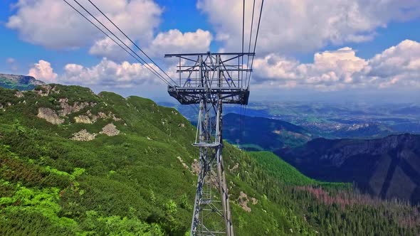 Travel by cable car from Kasprowy Wierch to Kuznice, Tatra mountain, Poland alt