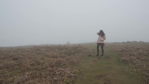 Still shot foggy day, asian female walking on Laurissilva forest, Madeira Island alt