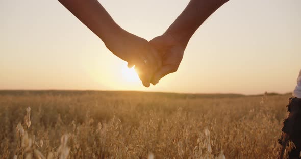 Couple In Love Holding Hands. Close Up