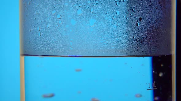 Glass Electric Kettle on Rotate Table Boiled Water Bubbles in Slow Motion