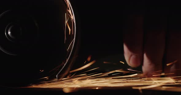 Closeup Shot Man Handles Metal with a Handheld Electro Instrument alt