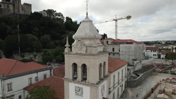 Belfry bell tower drone close up in portuguese church at Leiria, orbital shot