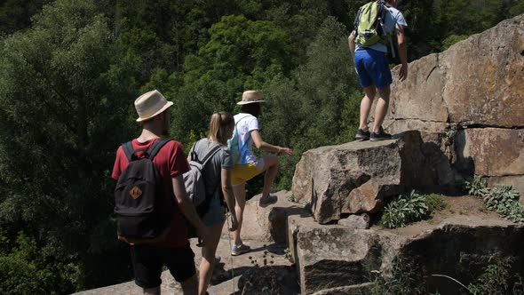 Group of Diverse Friends Hiking on Rocky Mountain alt