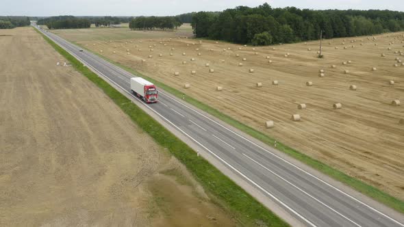 Truck Driving on Country Road alt