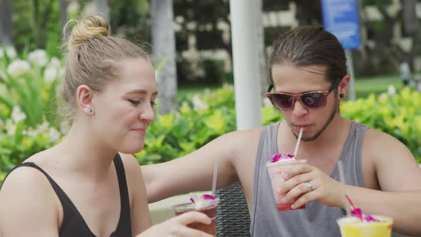 Couple in Hawaii having cocktails