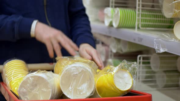 Closeup of Disposable Cups Stacked in a Shopping Cart for a Party or Birthday alt