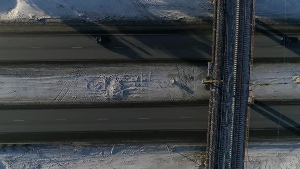 The camera flies over the railway railway bridge and moves right alt