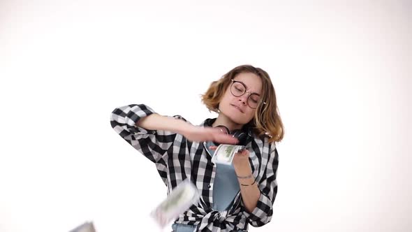 Slow Motion of Beautiful Curly Short Haired Girl Winning a Lot of Money and Throwing Dollar Bills in alt
