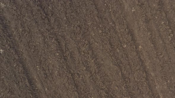 Above the earth after plowing 4K aerial footage alt