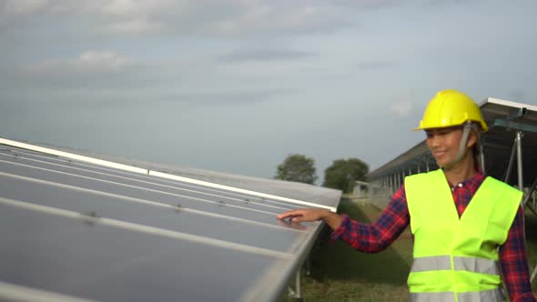 Aerial view of Engineering checking Solar cell Farm, Electricity production from the sun, alt