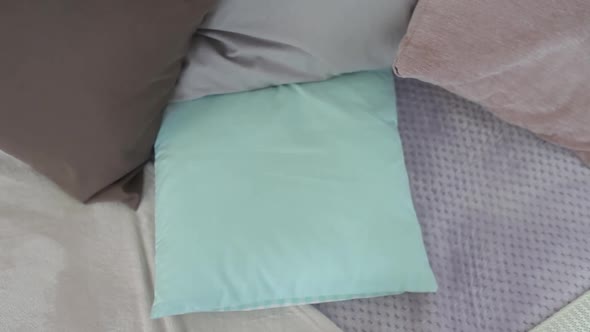 A Little Boy Lies Down on the Bed and Prepares to Sleep in a Good Mood alt