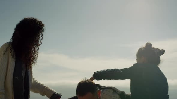 Family Playing Fun Together on Sunny Beach Day Outside alt