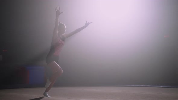 Training of Female Junior Artistic Gymnast on Floor Teen Girl is Running and Jumping Doing Flip alt