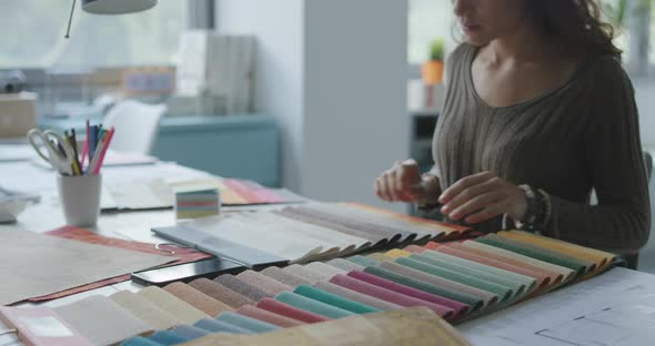 Professional decorator choosing fabric samples