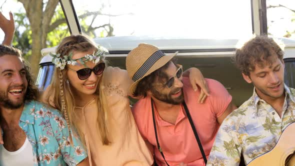 Smiling friends playing music alt