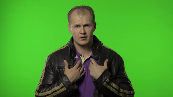 Rocker Man Looking at Camera with Embarrassed Expression, Have No Idea, Being Clueless and Uncertain alt