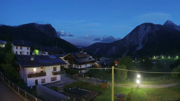 Night Falling on Beautiful Comfy Cottages in Mountain Area, European Village alt