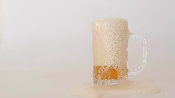 Beer Foam Overflowing From Glass