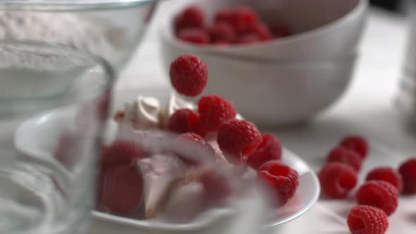 Raspberries falling onto dessert in super slow motion, shot on Phantom Flex 4K alt
