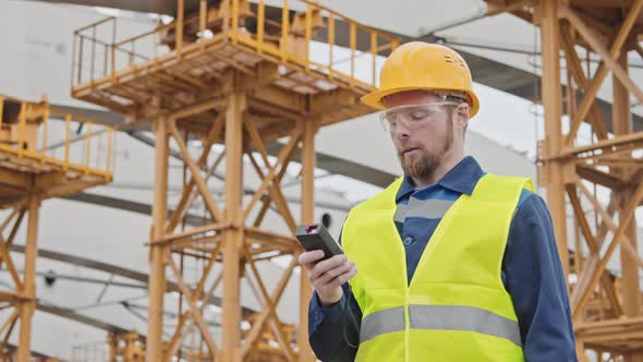 Engineer Inspecting Construction Site alt