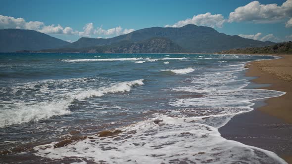 Slow Motion Waving Sea with Waves at Sunny Summer Windy Day at Beautiful Sandy Empty Beach Iztuzu in alt