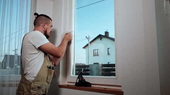 Window Service Worker Handyman Using Screwdriver to Fix Window Handle Repair and Installation alt