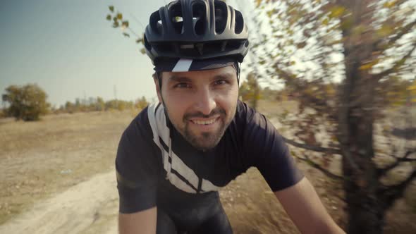Triathlete Training On Bike. Cycling Exercise On Bike. Cyclist Professional Fit Man Taking Selfie. alt