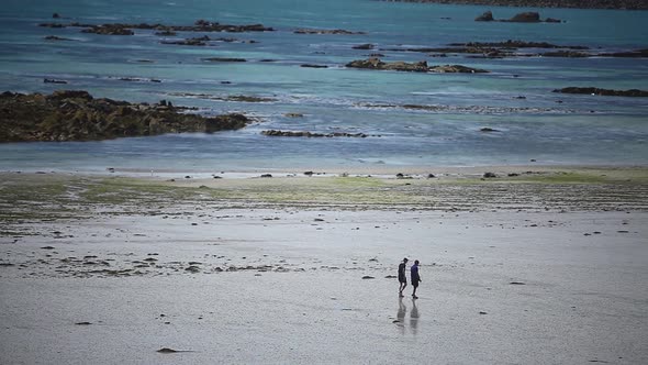 Men walking on a beach