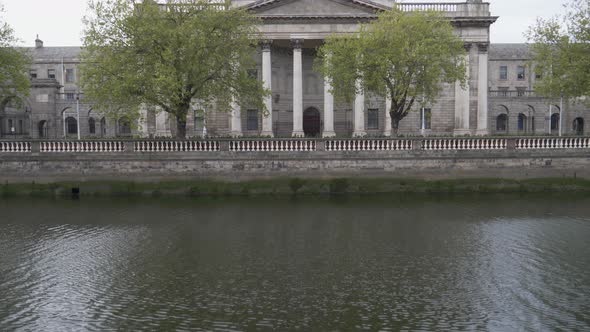 Four Courts Dome During RenovationWith Liffey River In Foreground At Inns Quay In Dublin, Ireland. - alt